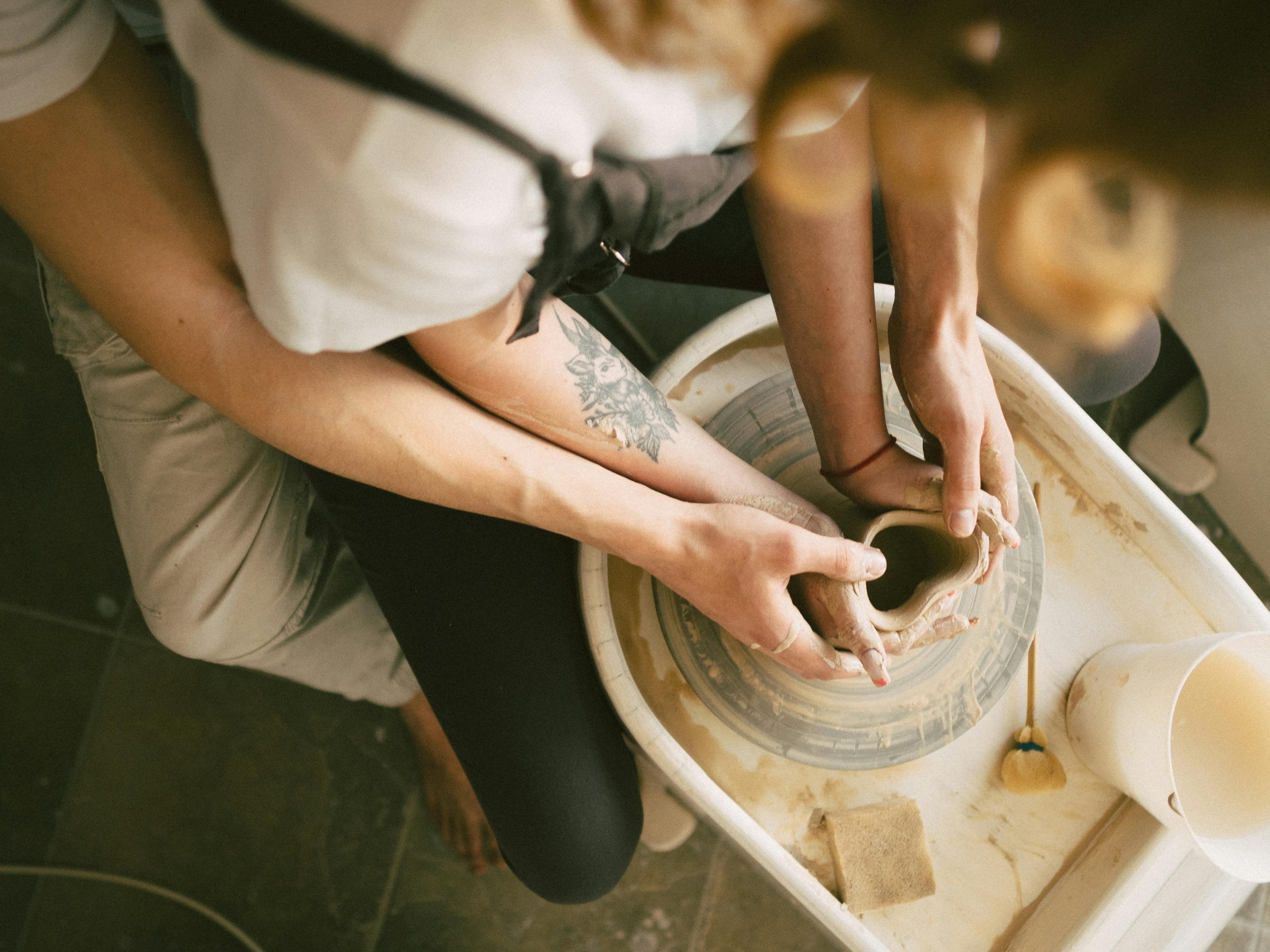 Artful Bonds: Crafting Love Through Creativity pottery wheel,couple collaborating